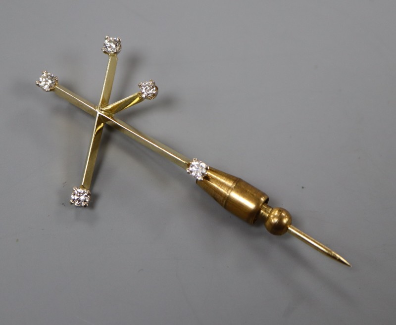 A 20th century yellow metal and diamond set Southern Cross constellation stick pin, 57mm, gross 4.9 grams.